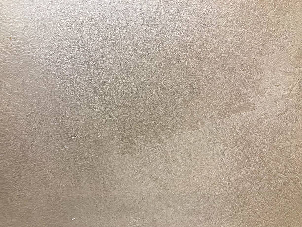 istock Close-up image of an object with irregular, possibly organic texture, resembling bark or rough paper Discolored patch in the middle, muted earth tone colors 2211343313