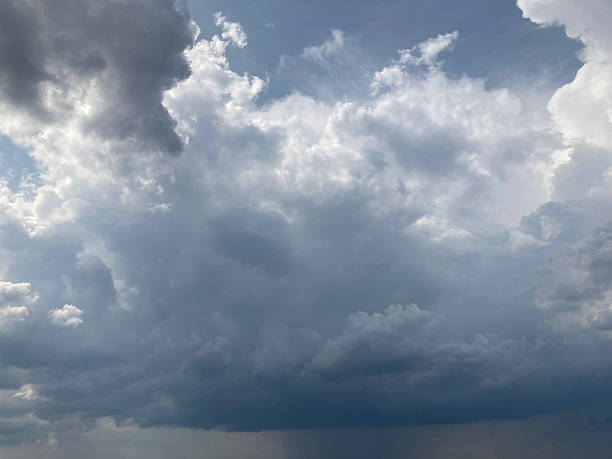 Image of an overcast or stormy sky filled with dense, grey clouds Clouds vary in thickness and some areas may contain rain or snow No text present The photograph captures a wide view without speci
