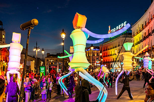 Tourists are enjoying a light show in Plaza Mayor during Spanish National Day, Madrid, Spain.