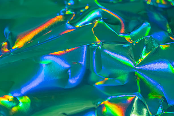 istock A high-resolution image showcases a shattered, iridescent material with rainbow hues The piece symbolizes fragility, resilience, or complexity 2211346166