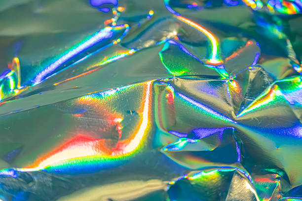 istock Image depicts a close-up of iridescent, metallic material with various color reflections, suitable for fashion, jewelry, or decoration Its well-lit and designed to catch light 2211346168
