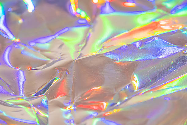 istock Image showcases an abstract, translucent, iridescent design with a spectrum of colors reflected on its surface, conveying futuristic technology, luxury, and innovation 2211346175
