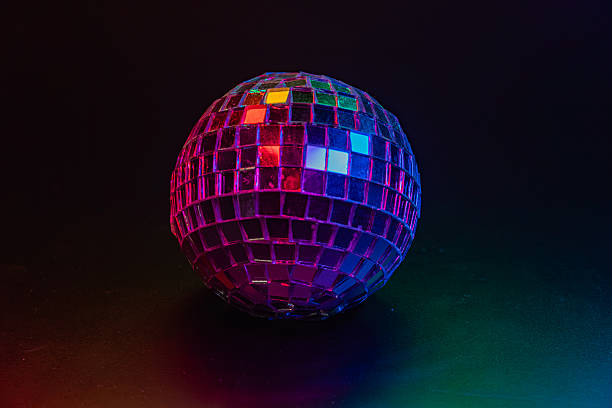 istock Disco ball with multicolored lights against a dark backdrop, reflecting vibrant colors Captures disco era atmosphere 2211346208