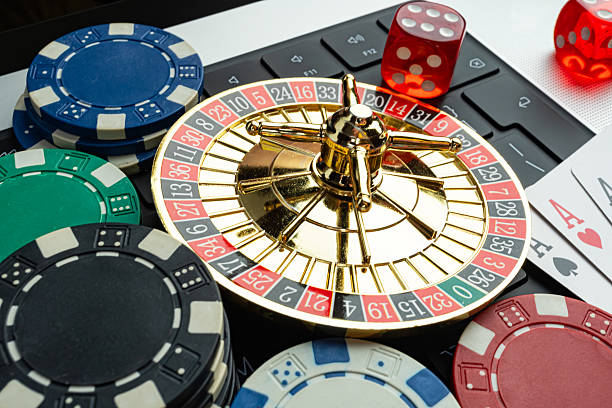 istock Image displays gambling items like roulette wheel, poker chips, and playing cards, suggesting a casino theme and the concept of risk-taking, luck, and gaming culture 2211346240