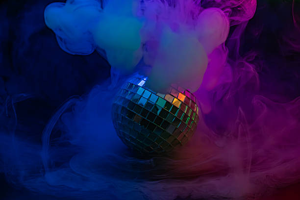 istock Image features a vibrant disco scene with a disco ball, colorful smoke, and dynamic atmosphere, suitable for party, club, or product launch promotions 2211346382