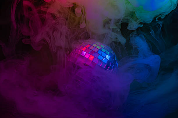istock Image showcases a disco ball against colorful, nebulous effects with an energetic glow, representing nightlife or party scenes 2211346416