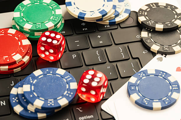 istock A creative stock image showcases a blend of casino chips, dice, and a computer keyboard, suggesting the fusion of traditional gaming with modern technology, possibly hinting at online gambling or dig 2211346553