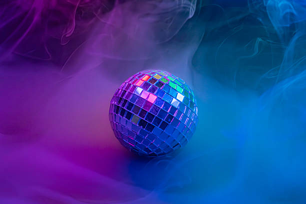 istock A dynamic stock image showcases a disco ball in colorful smoke, creating a kaleidoscopic effect and suggesting energy for nightclubsparties 2211346563