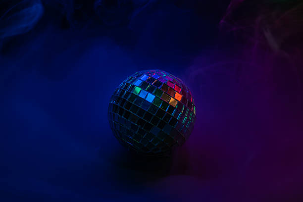 istock A lively, colorful stock image showcasing a disco ball illuminating a dark space, fitting for events like parties or entertainment 2211346569