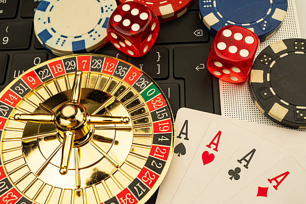 istock A vibrant collage featuring a spinning roulette wheel, scattered playing cards including royal flushes, and dice in various states The image suggests excitement and the allure of casino games 2211346682