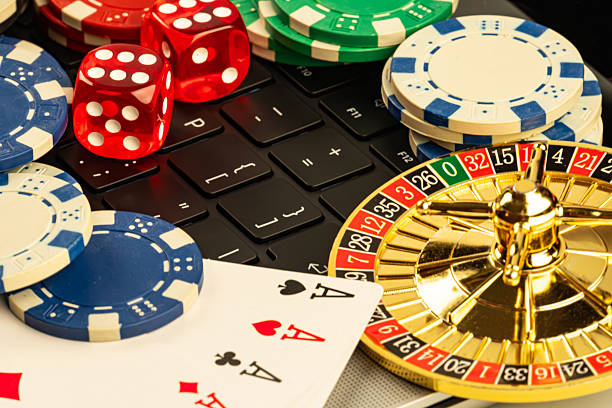 istock Image showcases a casino setting with a roulette wheel, poker chips, playing cards ace and king, suggesting gambling games Used for marketing casino entertainment, luxury, thrill 2211346686