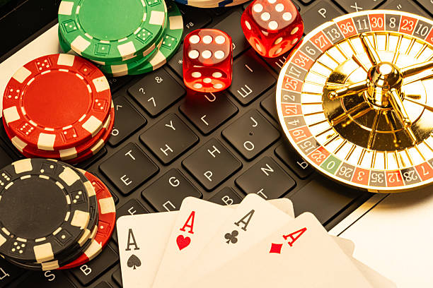 istock Image shows casino symbols, emphasizing gaming culture and chance elements Scattered playing cards Ace of Spades and roulette wheel suggest gambling activities Arranged on a table, possibly imply 2211346716