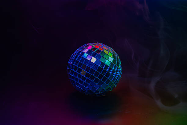 istock A disco ball radiating multicolored light against a black background, suggesting a party atmosphere 2211346718