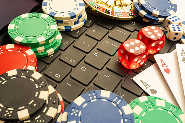 istock Image showcases vibrant casino chips and playing cards on a textured gaming surface, suggesting gambling culture, particularly poker or blackjack 2211346887