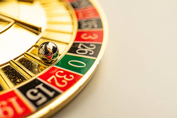 istock Roulette wheel with gold ball spinning in a luxurious casino setting 2211347068