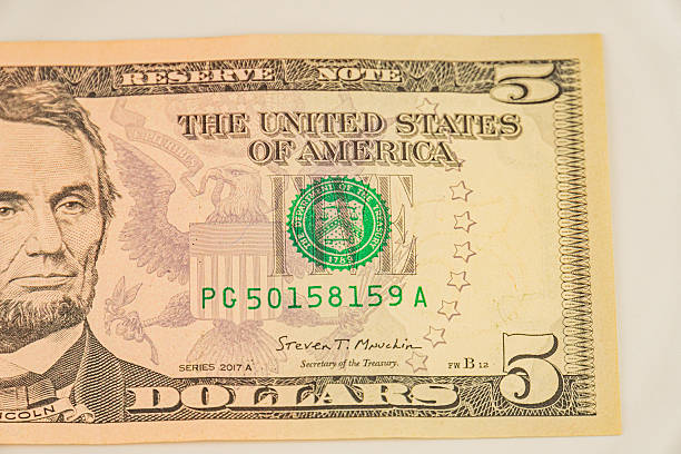 istock Image shows a US five-dollar bill with Abraham Lincolns portrait, featuring the text UNITED STATES OF AMERICA and FIVE DOLLARS It is a newer series note with security features against counterfeit 2211347086