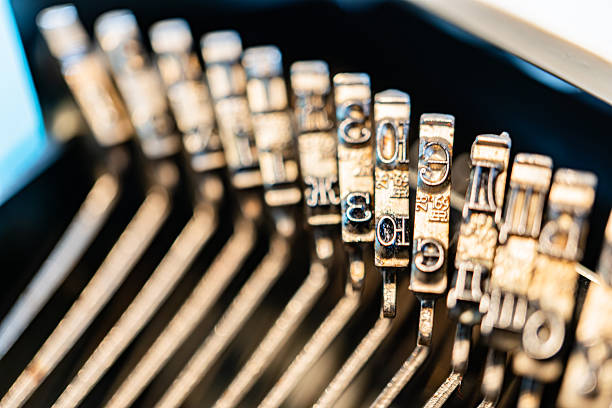 istock Close-up image of typewriter keys arranged in a grid, highlighting their metallic shine and individuality within a harmonious matrix The focus is on the tactile experience and mechanical beauty of t 2211347851