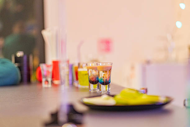 istock This image showcases luxury and relaxation at an upscale bar, featuring a vibrant cocktail, collection of drinks, elegant setting, dim lighting, and stylish furnishings 2211348010