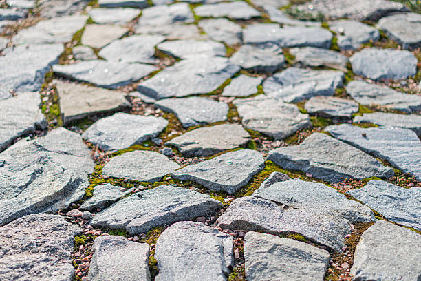 istock Image of a weathered stone pathway, showcasing history, rustic appeal, and enduring craftsmanship Ideal for projects about heritage sites, sustainable tourism, or designs with natural aesthetics 2211348156
