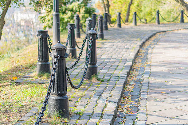 A tranquil autumn stroll along a cobblestone path, with man-made and natural elements blending harmoniously The image invites viewers to explore and daydream Ideal for marketing materials promoting
