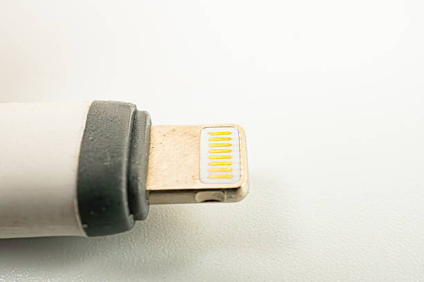 istock Image of a white, compact Apple USB power adapter, showcasing its sleek design and compatibility with various Apple devices Emphasizes durability, quality, and user-friendly experience 2211348621