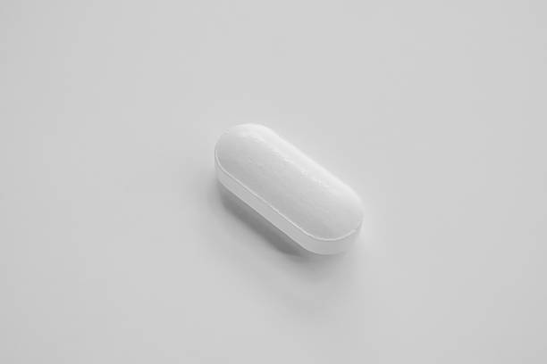 istock White medicine pill tablet on white background 2211348640