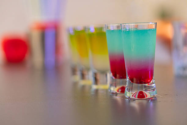 istock A vibrant, layered shot glass image showcases a skillfully prepared cocktail display, exuding fun and relaxation in a casual, inviting setting 2211348807