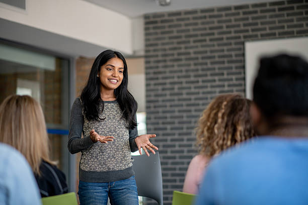 istock Woman Leading a Professional Meeting in a Modern Office Setting 2211349001