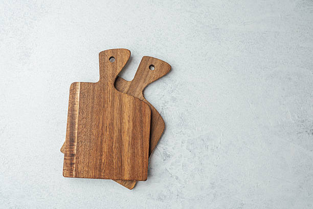 istock Wooden cutting boards arranged on a gray kitchen surface for cooking preparation 2211349490