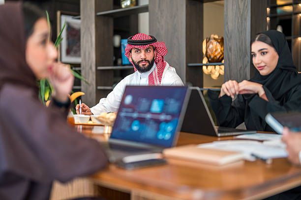 istock Confident Arabic Male and Female Leaders Discussing Strategy 2211350138