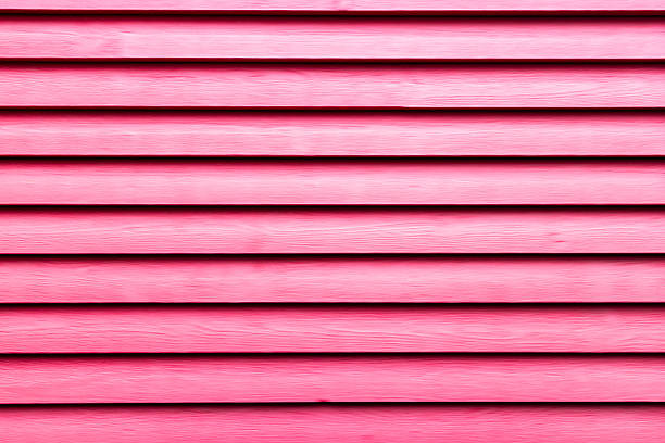 istock Close-Up of Red Painted Wooden Siding Creating a Bold Geometric Pattern 2211352800