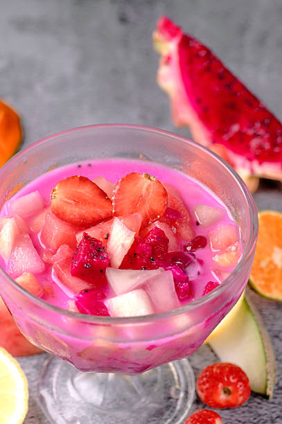 istock A glass bowl filled with pink fruit juice and strawberries 2211353021