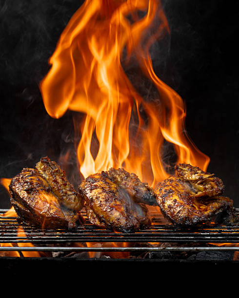 istock Three pieces of chicken are being cooked on a grill 2211357335