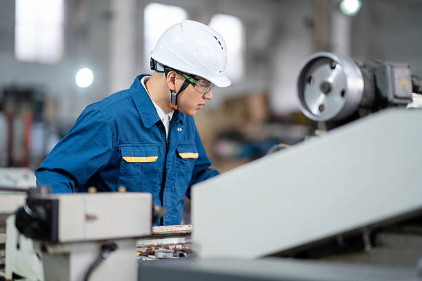 istock asian male engineer working on lathe 2211363391