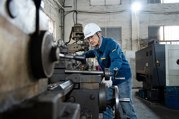 istock asian male engineer working on lathe in factroy 2211363526