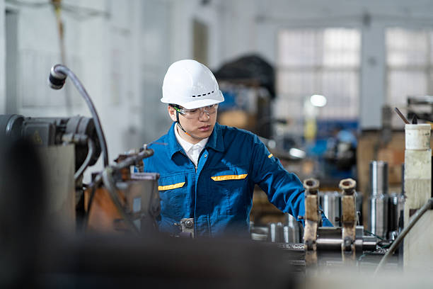 istock asian male engineer working on lathe 2211363911