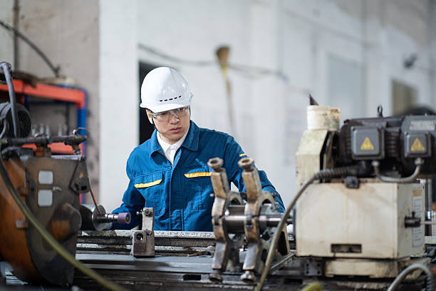 istock asian male engineer working on lathe 2211363918