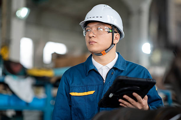 istock asian male engineer working with digital tablet in factory 2211364145