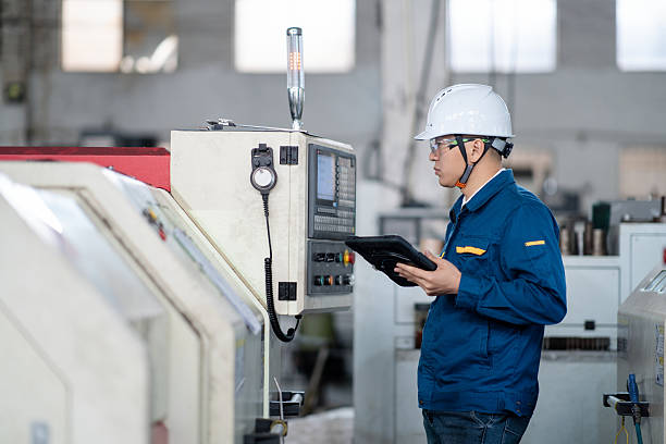 istock asian male engineer working with digital tablet in factory 2211364520