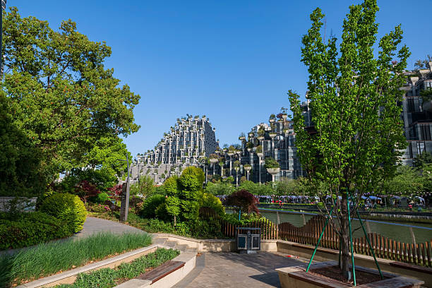 Garden riverside by Tian'an Sunshine Plaza known as 1000 trees building against blue sky, Shanghai, China. Famous travel destination for photograph and shopping.