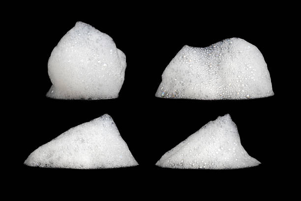istock White soap foam set, shampoo foam with bubbles, white, cream soap bubbles, isolated on black background 2211372705