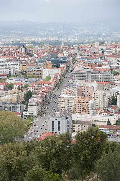 istock Cityscape with Road and Distant Mountains 2211378045