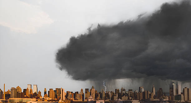 istock Storm cloud over city skyline 2211378386