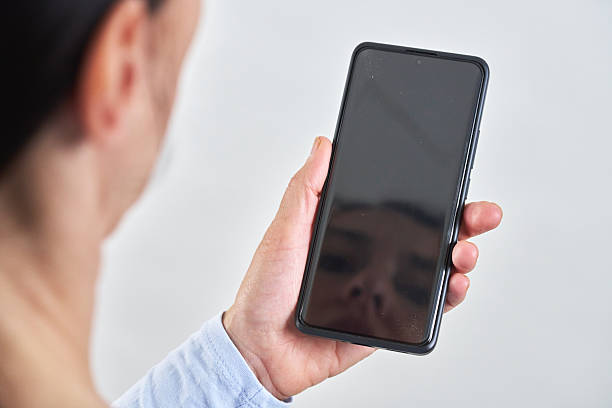 istock Middle-Aged Woman Interacting and Using Smartphone 2211378475