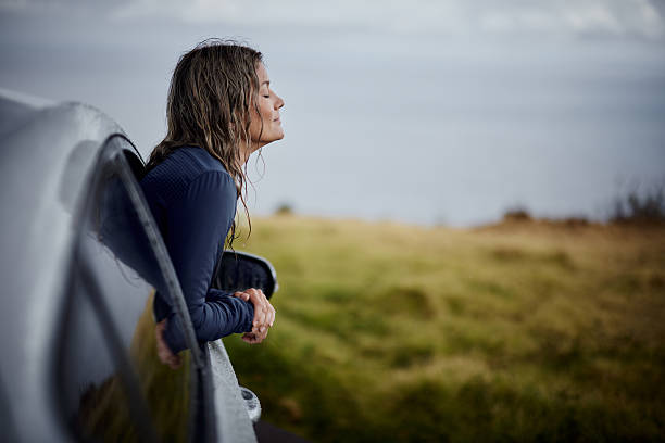 istock Inhaling fresh air from the car! 2211378979
