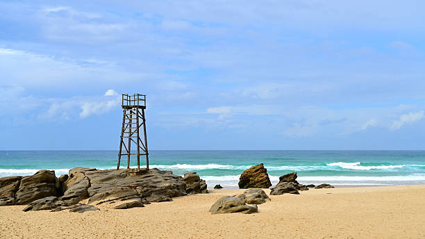 Old wooden shark watch tower at Red Head beach in NSW