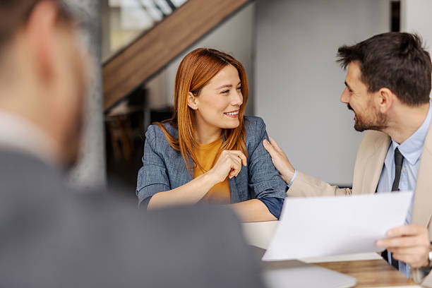istock Colleagues discussing paperwork at meeting room. 2211379001