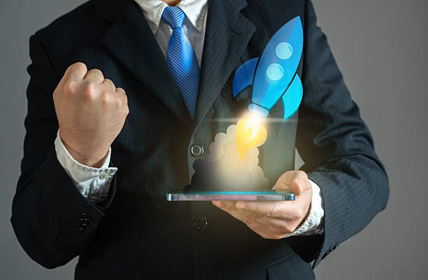 istock Businessman excited about rocket launch, startup concept. Entrepreneurship, launching new projects, ambition, market expansion, and financial breakthroughs. 2211379131