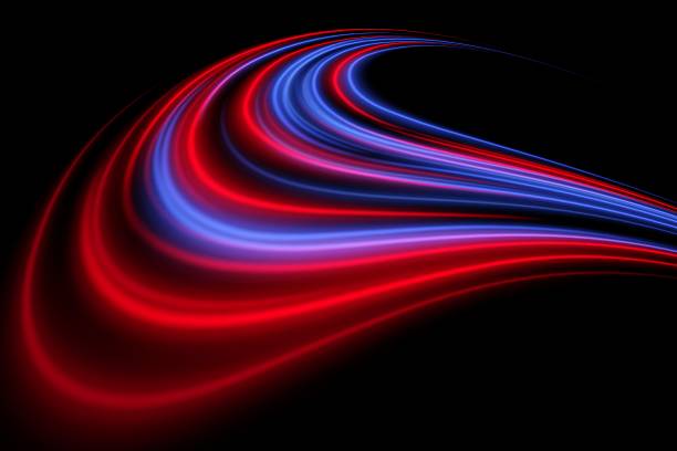 istock Glowing stream curve. Red and blue arcs flow with layered depth on black. Motion sweep, vibrant transition, abstract pulse. 2211379410