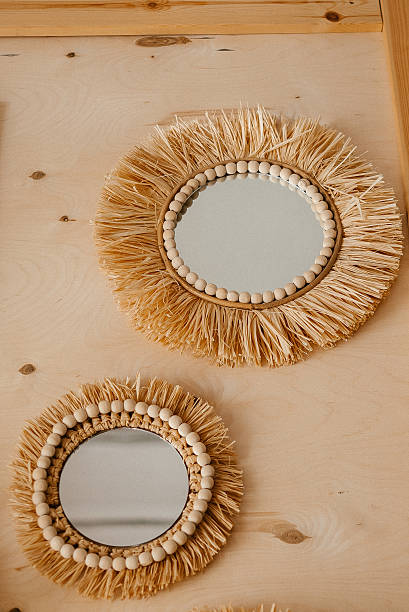 istock Decorative Wooden Frame Mirrors on Beige Wall 2211383416